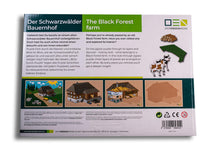 Laden Sie das Bild in den Galerie-Viewer, Blick-Durch-Puzzle: Schwarzwälder Bauernhof Verpackung von unten