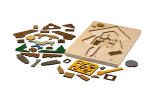 Blick-Durch-Puzzle: Schwarzwälder Kuckucksuhr Puzzleteile neben Brettspiel